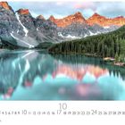 Alberta, Casares Edition, 10. Bergsee mit türkisfarbenem Wasser, umgeben von Nadelwäldern und Bergen im Hintergrund.