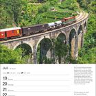 Juli-Kalender mit Bild von einem Zug auf hoher Steinbrücke im Grünen. Text erklärt technische Details der Loks.