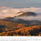 Kalenderblatt für Oktober 2027. Herbstliche Hügel im Siebengebirge mit Nebelschwaden und einem Turm auf einem Hügel.