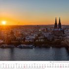 Kalender Oktober 2027: Der Kölner Dom im Sonnenuntergang, der Rhein im Vordergrund.