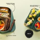 Box 1: Dinkelbrot mit Frischkäse, Gemüsesticks. Box 2: Spieße mit Käse und Gurke, gekochtes Ei, Obstsalat.