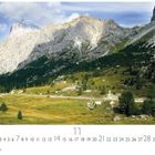 Text: "Falzarego Paß", "11", "CASARES EDITION". Landschaft mit Bergkulisse, grünen Wiesen und vereinzelten Bäumen.