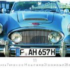 Ein blauer Oldtimer, ein Austin-Healey 3000, ist frontal abgebildet. Ein deutsches Kennzeichen ist sichtbar.