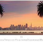 Text: Skyline im Morgenlicht, Casares Edition, Zahlen von 1 bis 30.  
Zu sehen: Zwei Palmen, Skyline, Sonnenaufgang.