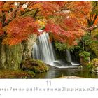 "Indian Summer. 11. CASAES EDITION." Herbstliche Landschaft mit Wasserfall, rotem Laub und Felsen.