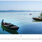 "Bei Friedrichshafen", Kalenderblatt für November. Ein Mann rudert in einem Boot auf einem See bei klarem Wetter.