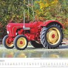 NOVEMBER-Kalenderblatt. Roter Porsche Diesel Super Traktor vor herbstlichem Waldrand. Großes Rad gelb mit roter Nabe.