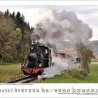 Kalenderblatt mit Zahlen 11 bis 30 unten. Dampflokomotive fährt durch grüne Landschaft mit Bäumen im Hintergrund.