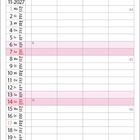 Kalender für November 2027. Eine Küstenlandschaft bei Sonnenuntergang mit Felsen und Meer im Hintergrund.