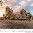 Kalendarium für November 2023. Bild zeigt eine beeindruckende gotische Kathedrale bei Sonnenuntergang, umgeben von Bäumen.