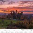 Kalender für November 2027, Siebengebirge - Schloss Drachenburg bei Sonnenuntergang, Bäume und Wiesen im Vordergrund.