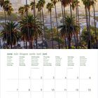 Kalender für Juni, mit Wochentagen in mehreren Sprachen. Oben: Skyline mit Palmen und einem sonnigen Himmel.