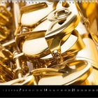 Das Kalenderblatt zeigt die Zahlen 11 bis 30. Nahaufnahme eines goldenen Saxophons mit Tasten und Mechanik.