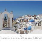 Text: "Santorini, Panorama" und "12". Bild zeigt weiß-blaue Architektur und blaues Meer.