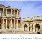 Text: "Ephesus", "12", "CASARES EDITION". Antike Ruinen mit Säulen und Bögen vor blauem Himmel.