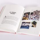 Zwei Buchseiten mit dem Titel "Le Pique-Nique", Text und vier Fotos, die Szenen eines Picknicks und Pariser Ansichten zeigen.