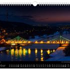 Kalenderblatt für Dezember, zeigt eine beleuchtete Brücke über einem Fluss in nächtlicher Winterlandschaft.