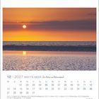 Kalenderblatt: 12 | 2027 WATT'N MEER, Die Natur im Nationalpark. Sonnenuntergang über dem Meer mit reflektierendem Wasser.