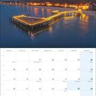 Kalender für Dezember 2027. Oben: beleuchteter Pier an der Küste bei Nacht. Text: "Föhr Meine Insel".