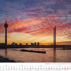 „Niederrhein – Abendstimmung über dem Medienhafen in Düsseldorf“. Kalenderbild Dezember 2027, Sonnenuntergang über Fluss und Skyline.