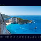 11. November, Kalenderansicht. Text beschreibt die Insel Zakynthos mit türkisblauem Meer und einer Bucht mit Booten.