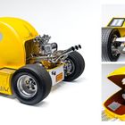 Text: "PAC-MAN Rod". Ein gelbes Fahrzeug im Stil von Pac-Man, mit sichtbarem Motor und verchromten Details.