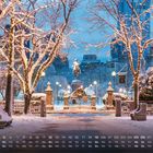 Ein schneebedeckter Park mit beleuchteten Bäumen und einer Reiterstatue, Kalender im Vordergrund, "12".
