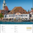 Kalenderseite mit Datum von Juni/Juli 2027. Im Hintergrund Landungsplatz mit Gebäude und Kirchturm.