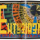 Text: "Ентузіазм (Симфонія Донбасу)". 
Illustration: Bunte, konzentrische Kreise mit großen, gelben Buchstaben.