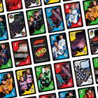 "Formula 1" und "UNO" mittig auf einer Karte. Mehrere Karten mit Rennbildern und Zahlen wie 3, 4, 6 und Figuren.