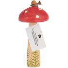 Etikett: "Holz-Fliegenpilz, Wooden Fly Agaric Mushroom". Holzpilz mit rotem Hut, weißen Punkten, Schnecke obendrauf.