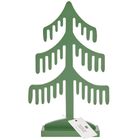 Text: "Kimici Kimlikleri Değiştiren Çok Satan Roman"  
Eine minimalistische, grüne Tannenbaum-Holzfigur.