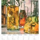 Kalender für Februar 2027. Kräuter und Gemüse in Öl in Glasflaschen. Montag bis Sonntag-Format, Valentinstag markiert.