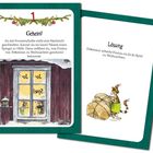 Karte mit Rätsel und Lösung zu Weihnachten. Illustration von Findus, der ein großes Paket umarmt.