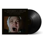 Schwarzes Albumcover mit Text: "The Testament of Ann Lee" und schreiende Frau in Nahaufnahme. Links abgebildetes Vinyl.