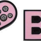 Links ein pinkes Herz mit glitzernden Steinen, rechts die Buchstaben "BP" in Pink.