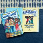 Oben: "The Brainstormerz: Money Talks." Unten: Autoren und Illustrator. Cover zeigt drei fröhliche Kinder in bunter Kleidung.