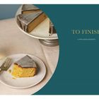 Text: "TO FINISH A FEW GOOD DESSERTS". Teller mit Kuchenstück und Glas Saft auf heller Tischdecke.