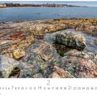 Text oben links: "Victoria, British Columbia". Kalenderansicht des Monats Februar, felsige Küste mit Meer im Hintergrund.