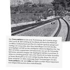 Titel: EL TRANSCANTÁBRICO. Schwarzes Logo auf weißem Grund. Schwarz-Weiß-Foto zeigt Bahngleise in gebirgiger Landschaft.