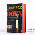 „JAN BECK DORN RUF DER TOTEN.“ Ein Schlüssel mit Anhänger steht vor einem Buch. Rechts Text: „Mit Farbschnitt...“