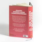 Rückseite eines rot-grauen Buches mit Text zu Mozart und seiner Schwester. Titel am Buchrücken: "WIR WAREN WUNDER".