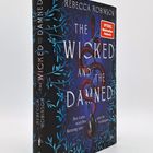 Buchtitel: "The Wicked and the Damned". Blauer Hintergrund mit roten Schlangen und blauen Pflanzenmotiven.
