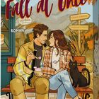Titel: "Fall at Once." Illustration: Ein Paar sitzt auf einer Bank, umgeben von Herbstlaub, ein schwarzer Kater ist nah dabei.
