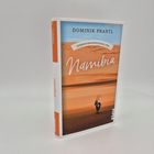 Buchcover: "Dominik Prantl, Gebrauchsanweisung für Namibia". Bild: Wüste mit Antilope, blauer Himmel.