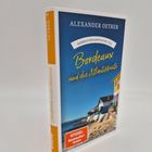 Text: "Gebrauchsanweisung für Bordeaux und die Atlantikküste", "Alexander Oetker", "Spiegel Bestseller-Autor".  
Ein Buch mit Küstenlandschaft.