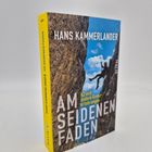 Buchtitel: "Am seidenen Faden: K2 und andere Grenzerfahrungen" von Hans Kammerlander. Cover zeigt kletternde Person.