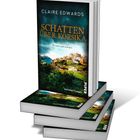 "SCHATTEN ÜBER KORSIKA: Kriminalroman", Autor Claire Edwards. Bild zeigt eine malerische Stadtlandschaft auf Büchern.