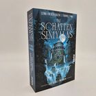 "Im Schatten Simyalas" von Lena Falkenhagen und Thomas Finn. Dunkle Burg vor Nachtlandschaft, Wasserfall im Vordergrund.