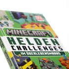 "Minecraft Helden Challenges im Überlebensmodus" steht auf einem Buchcover mit pixeligen Spielcharakteren.